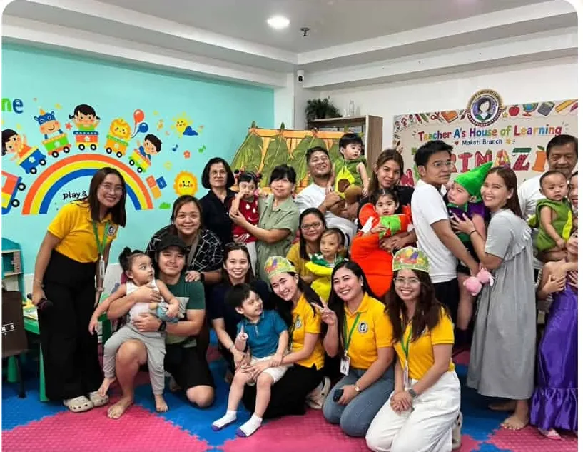 Teachers, parents and children gathered together in the colourful Teacher A's Makati classroom